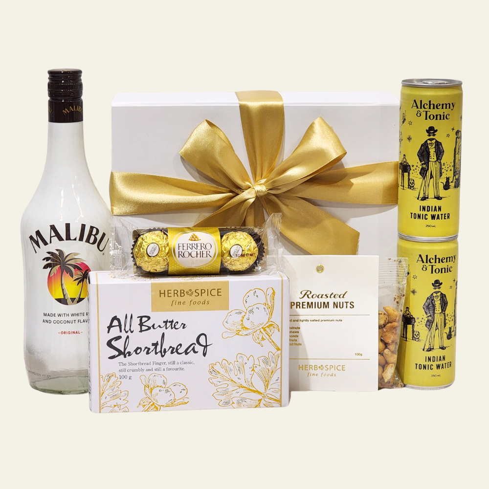 Tropical Bliss gift box featuring Malibu Rum Liqueur, snacks, and elegant packaging for a tropical celebration.