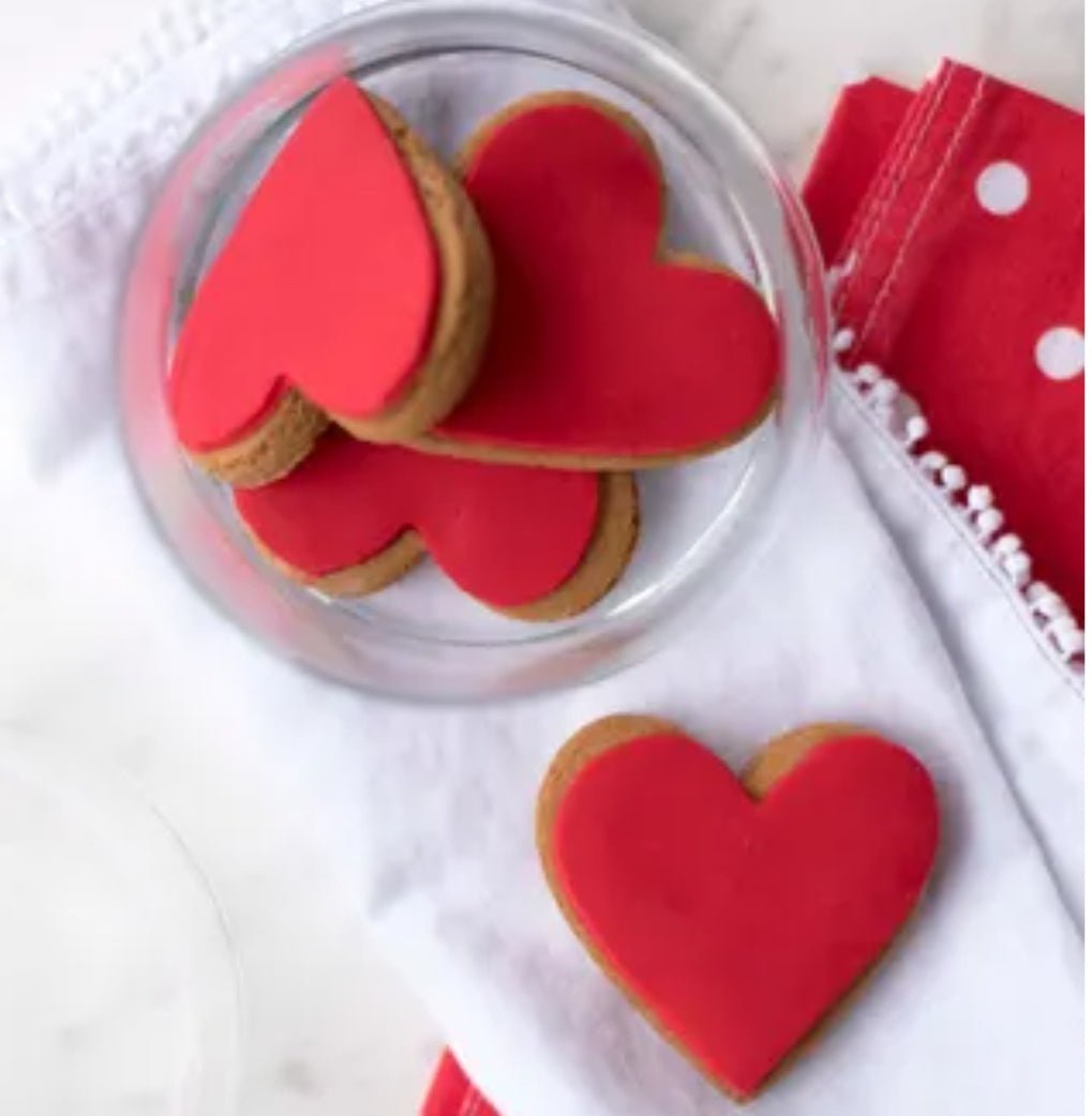 Heart-shaped ginger cookies with red icing in a twin pack, perfect for expressing love and celebrating special moments.