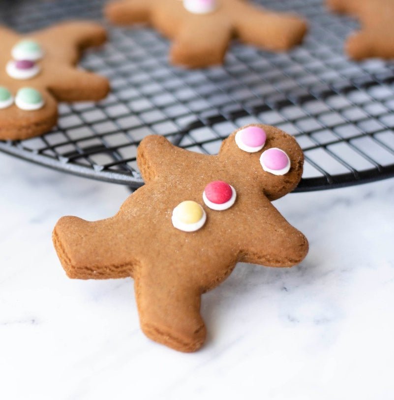 Delightful Molly Woppy Ginger Kid featuring crisp gingerbread and natural fruit-coloured buttons, made in New Zealand.