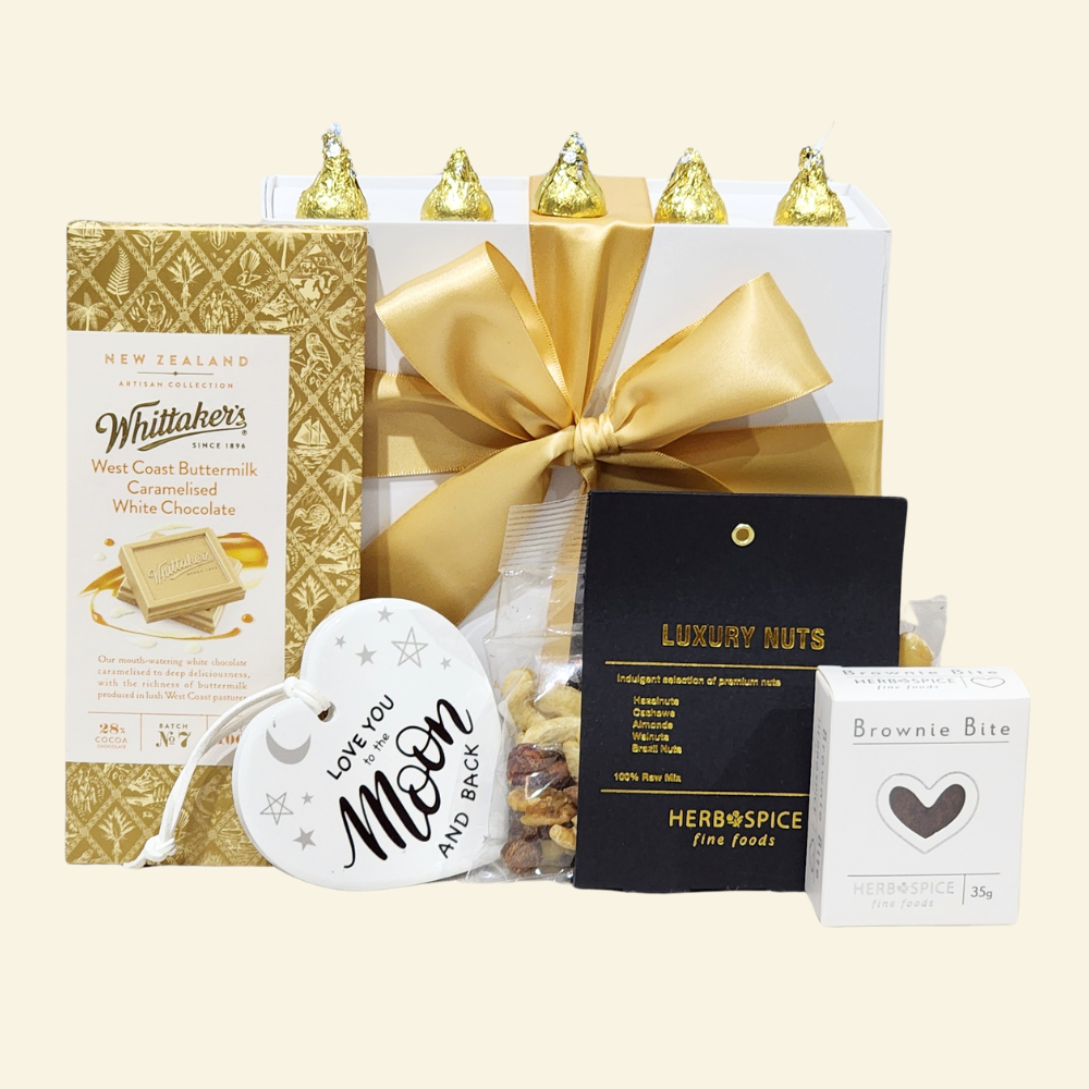 Gift box with heart wall hanging, gourmet chocolates, premium nuts, and sweets, perfect for expressing love.