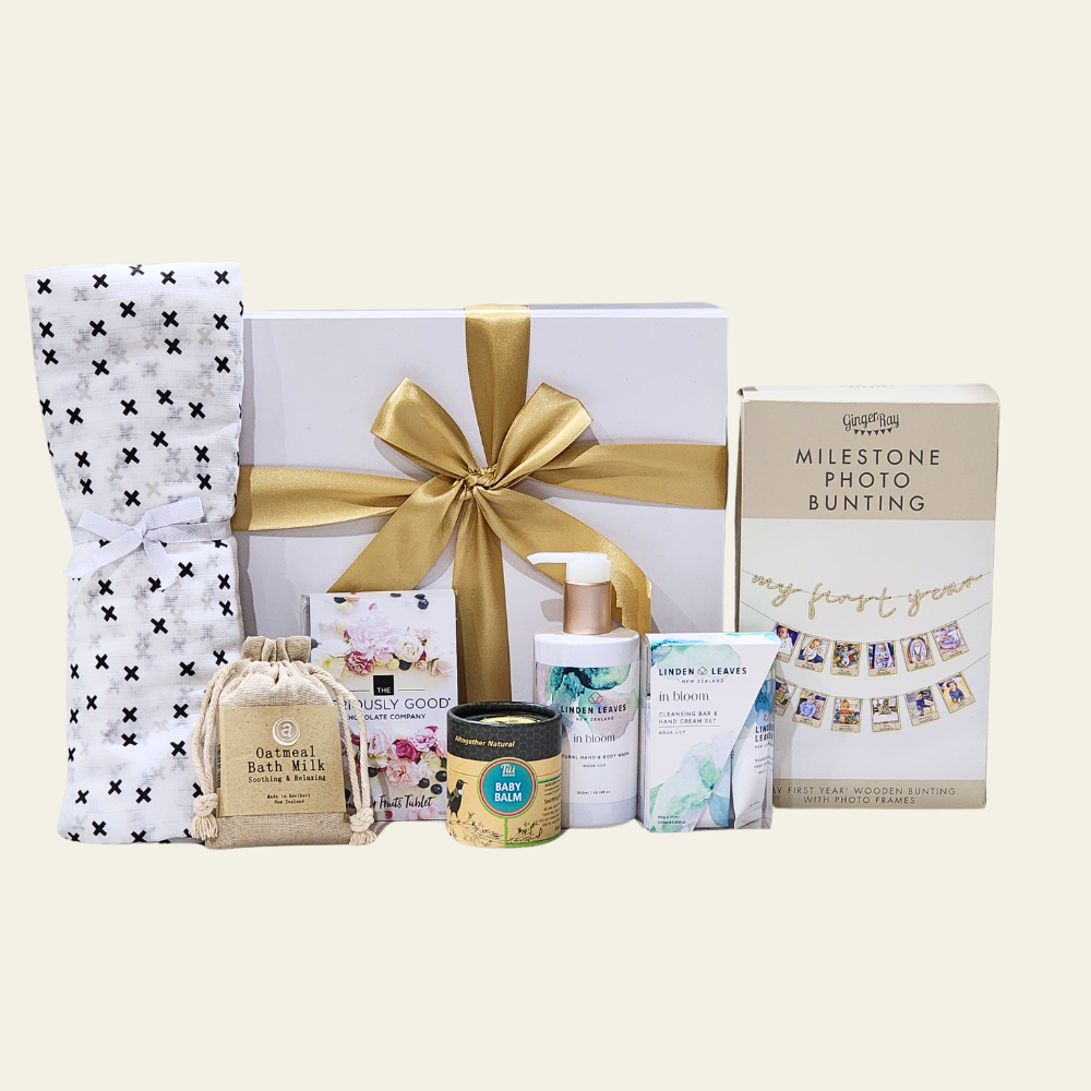 Luxurious gift box for new mum and baby with pampering treats and essential items for celebrating a new arrival.