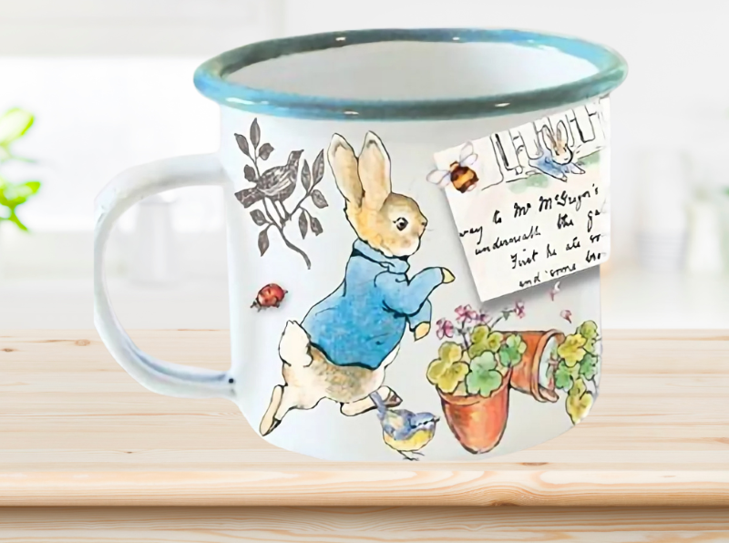 Charming Peter Rabbit enamel mug featuring whimsical illustrations, perfect for nostalgic gifting and everyday use.