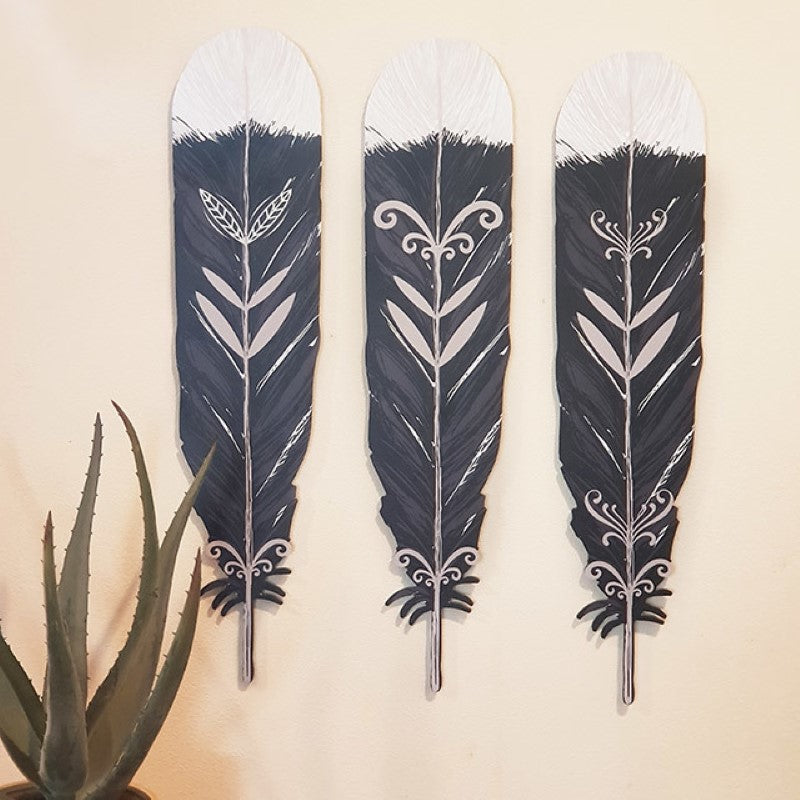 Kiwiana Wall Art featuring a set of lightweight, durable Huia feathers, elegantly displayed for a touch of New Zealand heritage.