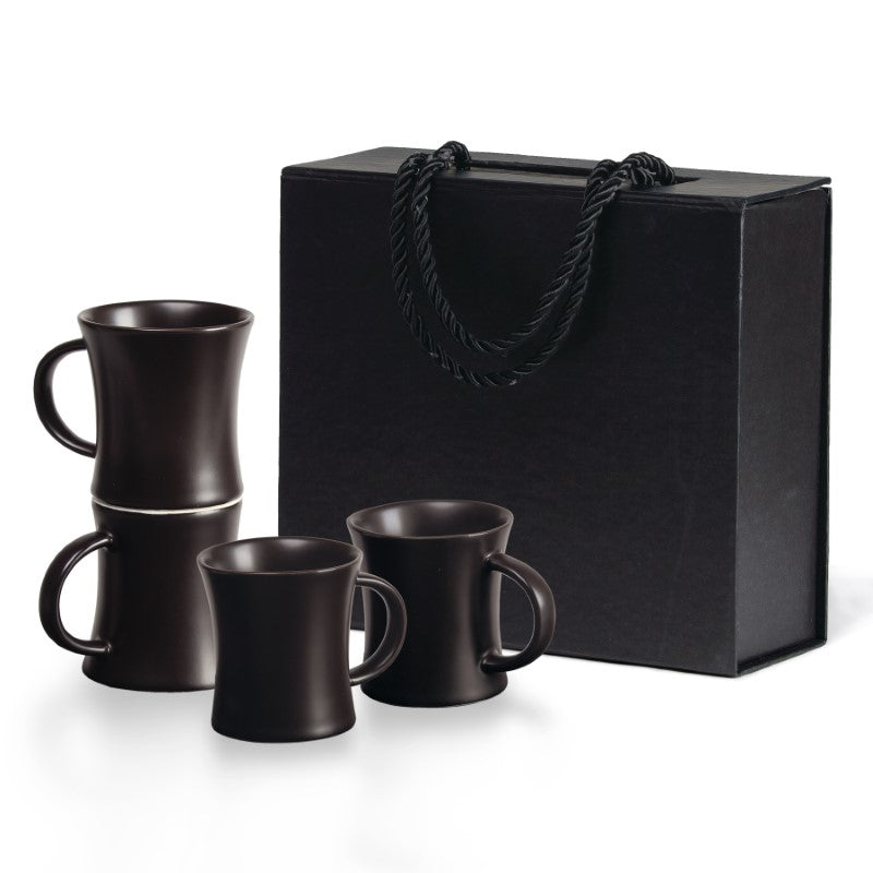 Elegant quartet espresso set featuring four matte black ceramic cups, perfect for coffee enthusiasts and stylish gifting.