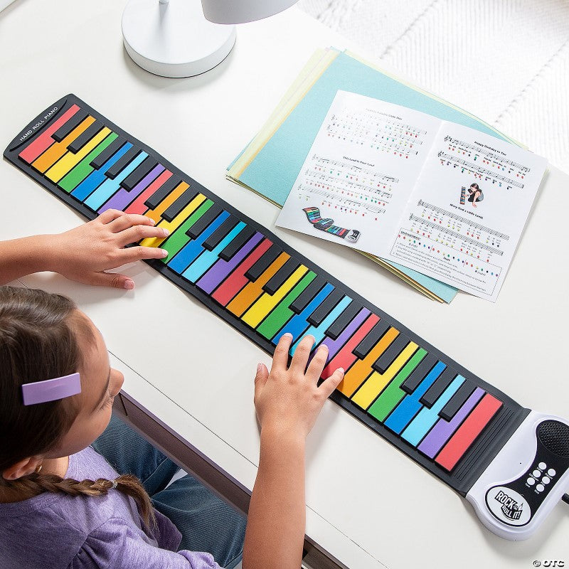 Vibrant Rainbow Rock and Roll It Piano with 49 keys, portable design, and included song booklet for music enthusiasts.