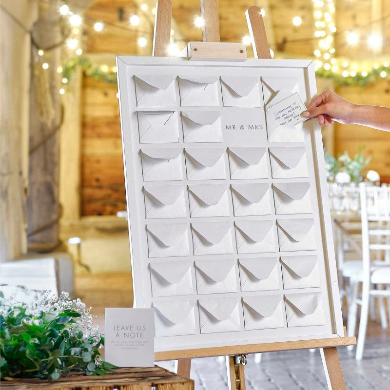 Wooden frame with mini pearlised envelopes for a unique wedding guest book alternative, perfect for heartfelt messages.