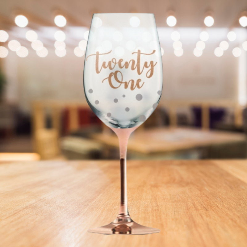 Hand-painted rose gold stem wine glass for 21st birthdays, featuring '21 Happy Birthday' in elegant script, 22.5 cm tall.