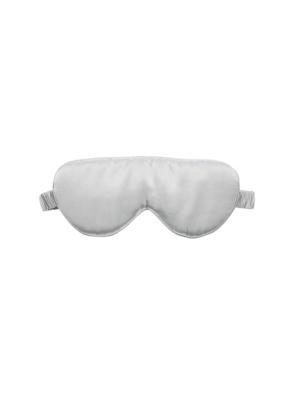 Luxurious pure silk sleep mask with padded design and elastic band for ultimate comfort, blocking out light for restful sleep.