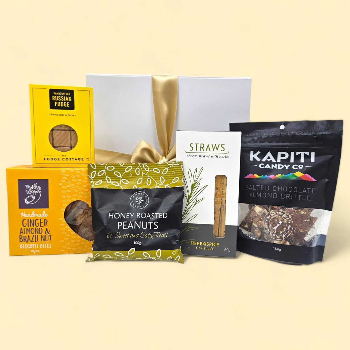 Savoury and sweet artisanal NZ treats gift box featuring fudge, biscotti, peanuts, brittle, cheese straws, and elegant packaging.