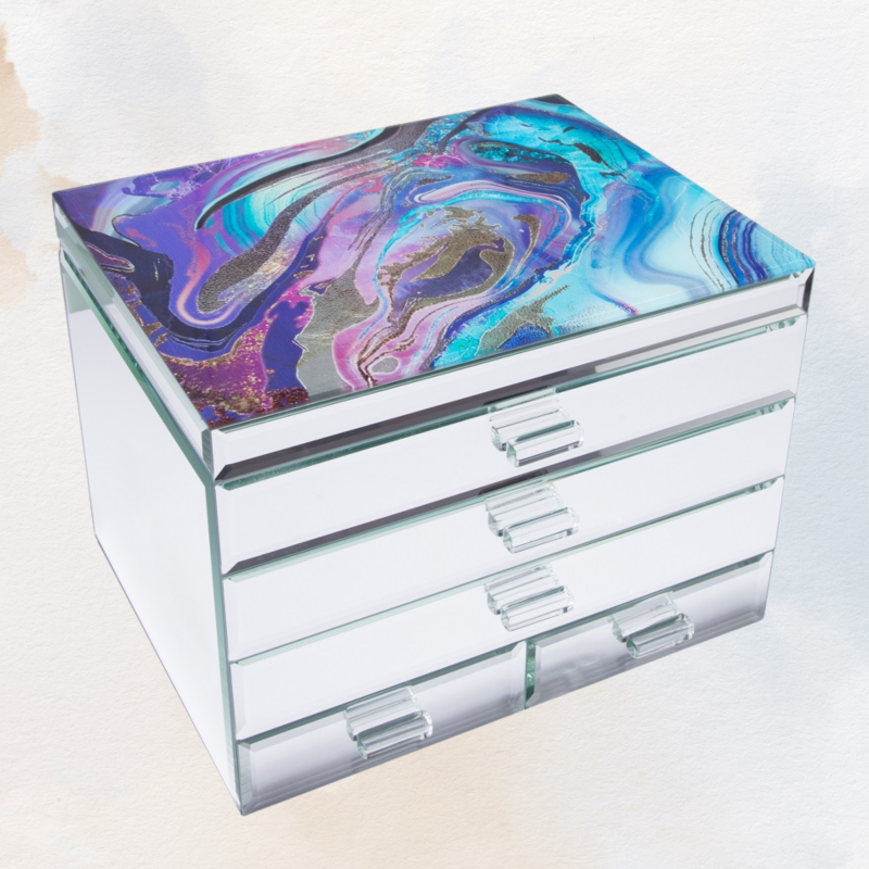 Elegant extra large glass mirror jewelry box with a plush interior, three top sections, and four spacious drawers.