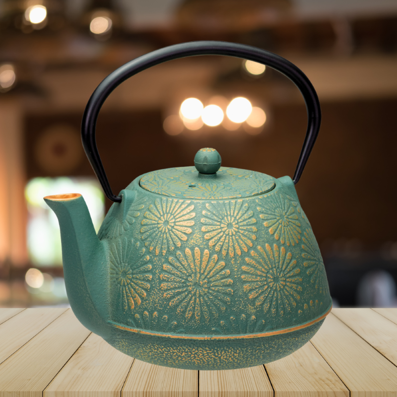 Elegant cast iron teapot in teal and gold, 1.2L capacity, featuring a stainless steel infuser for perfect tea brewing.