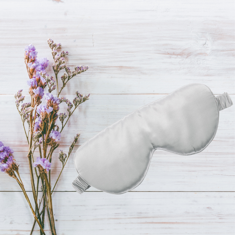 Luxurious pure silk sleep mask with padded design and elastic band for ultimate comfort and restful sleep.