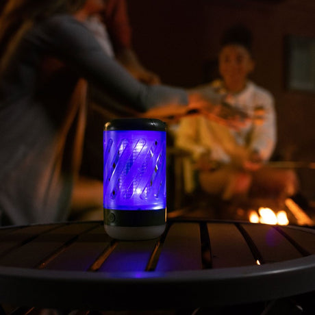 Portable Bug Eliminator with dual UV light and 360° grid, effectively zaps flying insects while providing ambient lighting.
