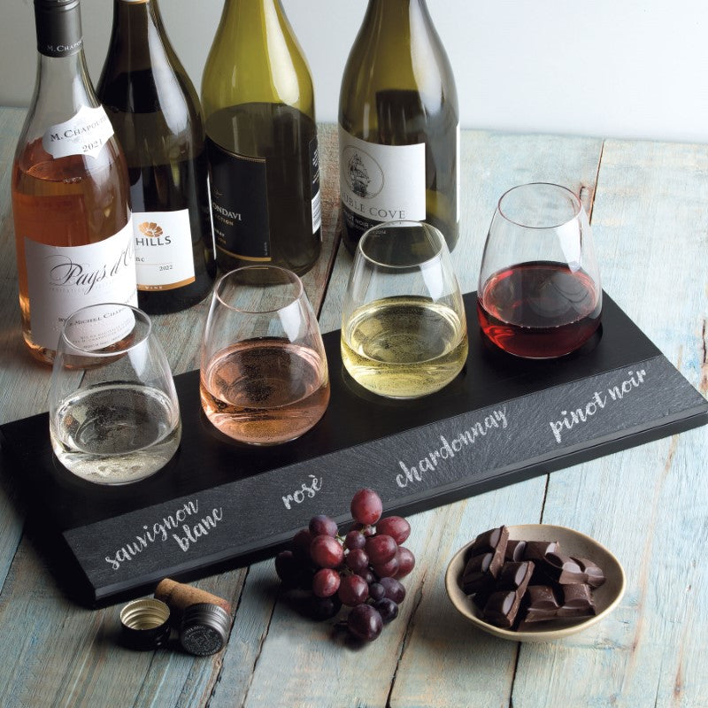 Elegant 7-piece wine tasting set with stemless glasses, pine tray, slate panel, and chalk for custom labeling. Perfect for enthusiasts.