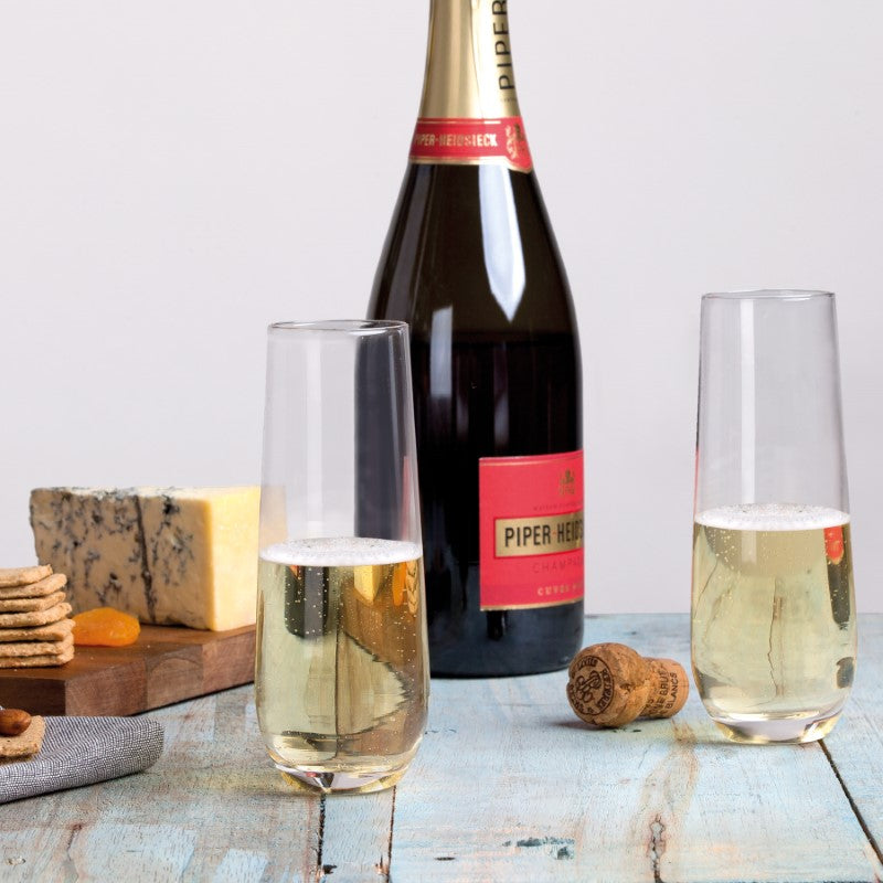 Set of 4 elegant stemless champagne flutes with slender bowls, designed for effortless handling and sophisticated charm.