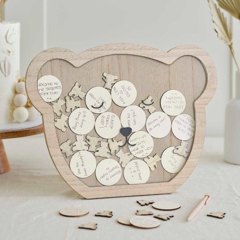 Wooden teddy-shaped guest book alternative with tokens for heartfelt wishes at baby showers, perfect for lasting memories.
