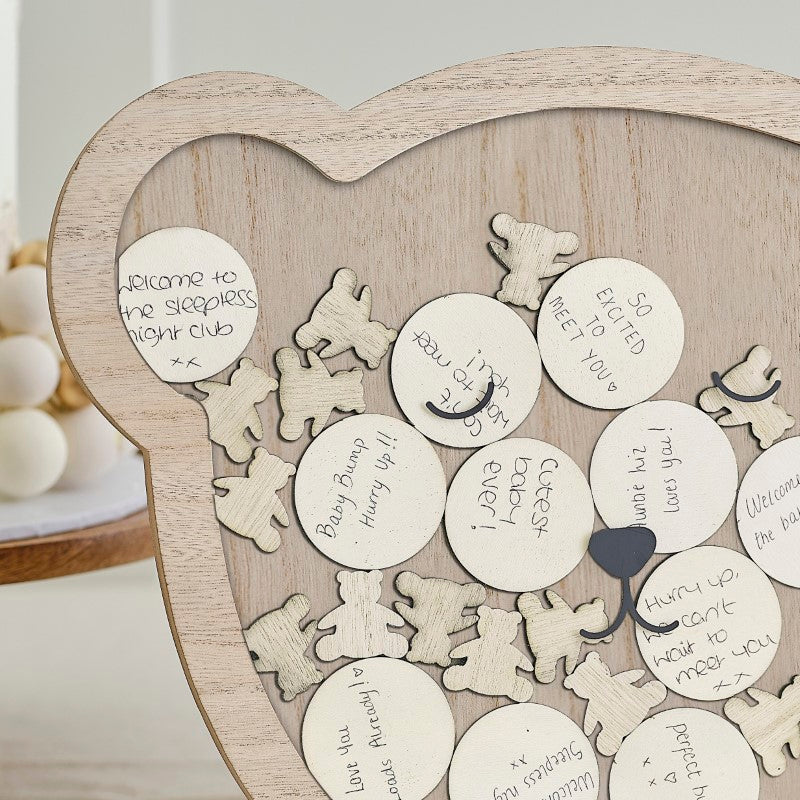 Wooden teddy guest book frame for baby showers, with tokens for heartfelt messages and well-wishes from guests.