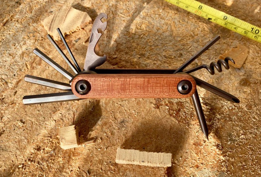 Multi-functional Moana Road Builders Wonder Tool with 12 features including bottle opener, spoke wrench, and corkscrew.