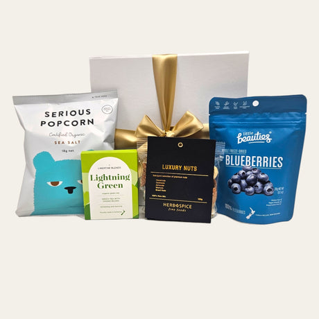 A beautifully crafted gift box filled with delicious vegan snacks, perfect for birthdays and special occasions.