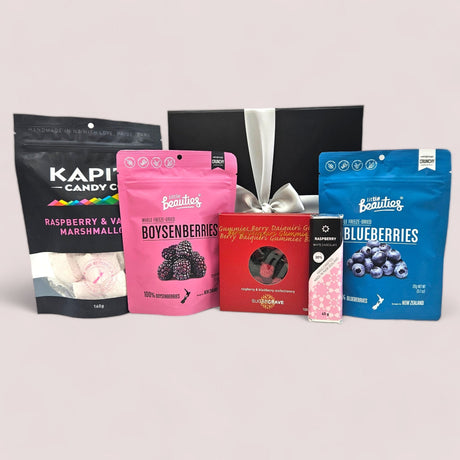 A beautifully arranged gift box full of berry-themed treats, perfect for any special occasion.