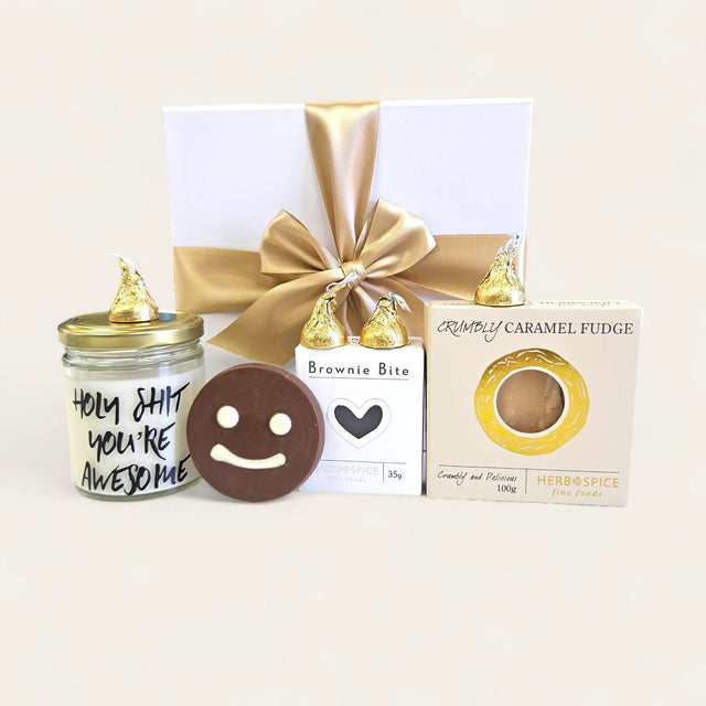 "This delightful gift box includes fudge, a candle, chocolate treats, and more to celebrate someone's awesomeness."