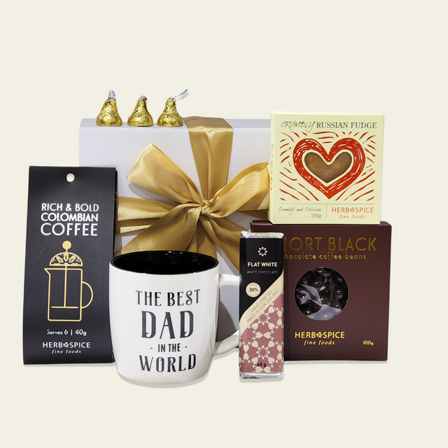 Elegant gift box filled with coffee treats: mug, coffee, chocolate, fudge, Kisses, and chocolate-coated coffee beans.