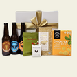 Brews & Bites Gift Box featuring craft beers and gourmet snacks, elegantly packaged for special occasions or relaxation.