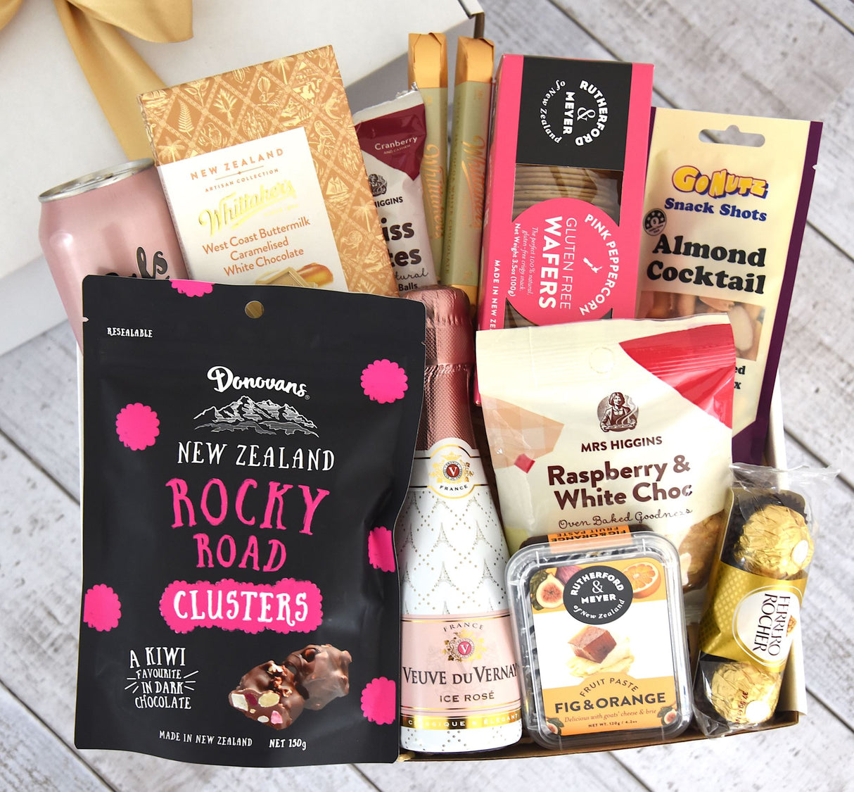 Cheers & Treats Gift Box featuring vodka soda, rosé, and gourmet snacks elegantly packaged for celebrations and special moments.