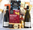 Elegant gift box featuring two premium wines and gourmet treats for a luxurious wine tasting experience.