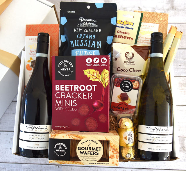 Elegant gift box featuring two premium wines and gourmet treats for a luxurious wine tasting experience.