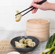 Avanti Bamboo Steamer Basket with domed lid, perfect for steaming vegetables, fish, and dim sum efficiently.