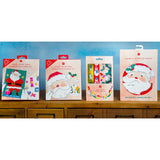 Christmas Card Making Kit for kids featuring festive stickers, pom poms, and cut-outs for creative holiday card crafting.