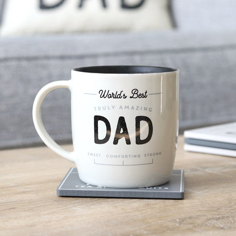 Ceramic mug for Dad with 'World's Best Amazing Dad' design, featuring a stylish black interior and gift-ready packaging.