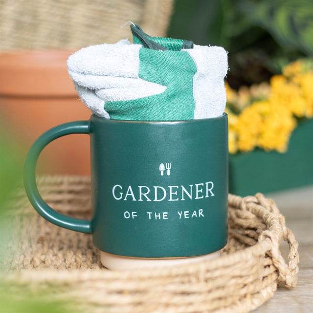 A charming 'Gardener of the Year' mug paired with durable gardening gloves, perfect for any gardening enthusiast.