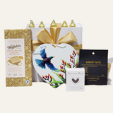 Gift box featuring Tui ceramic wall hanging and assorted gourmet treats, perfect for nature and food lovers.