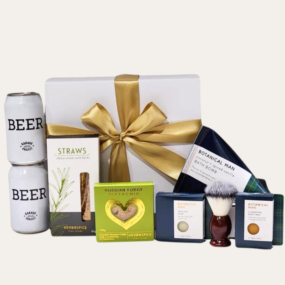 Luxurious gift box featuring premium self-care items for men, including beer, bath products, and gourmet snacks.