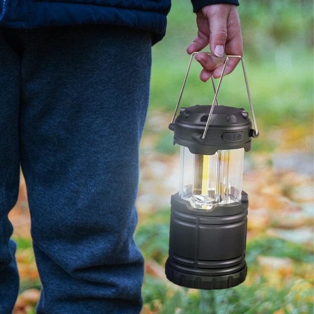 Bright and portable Lumina Lantern with COB modules, foldable handles, ideal for outdoor adventures and emergencies.