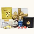 Luxurious gift box with Dancing Sands Dry Gin and gourmet treats like Lindor chocolates and maple chili cashews.