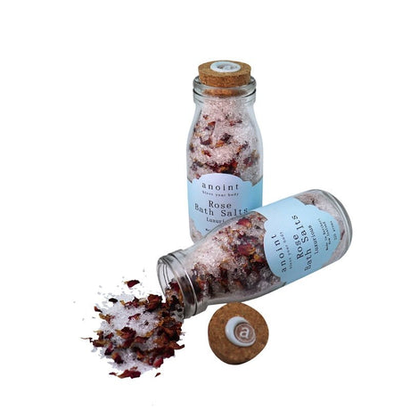 Anoint Rose Bath Salts in a jar, featuring pink rose petals and a soothing blend for a rejuvenating bath experience.