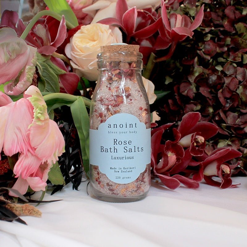 Anoint Rose Bath Salts in a glass jar, featuring Epsom salts, rose petals, and essential oil for a soothing spa experience.