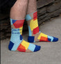 Colorful "Cool-Ass Grandpa" men's socks made of cotton blend, featuring a fun design for sizes 7-12, perfect for gifting.