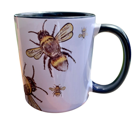 A stylish 325ml ceramic mug featuring Sarah McAlpine's charming bee design, perfect for tea, coffee, or hot chocolate.