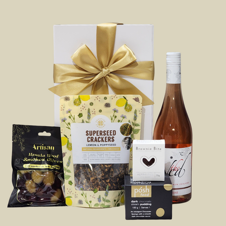 Elegant Blush & Nibbles Gift Box featuring wine, gourmet snacks, and indulgent sweets, beautifully packaged for any occasion.