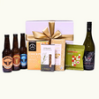 Brews & Blanc Delights gift box featuring craft beers, Sauvignon Blanc, and gourmet snacks for a memorable celebration.