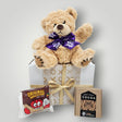 Get Well Soon gift box featuring a teddy bear, hot chocolate, and cookie for comforting get well wishes.