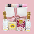 Elegant gift box filled with indulgent sweets, premium sparkling wine, and charming treats for memorable celebrations.