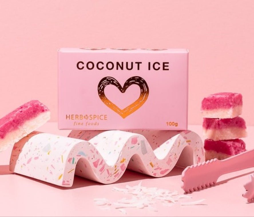 Classic pink and white coconut ice cubes in a 100g pack, perfect for sharing and indulging in nostalgic flavors.