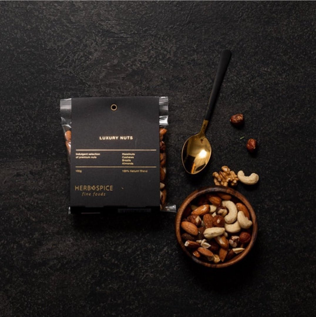 Luxurious 100g nut mix featuring cashews, hazelnuts, almonds, and walnuts for an elevated snacking experience.