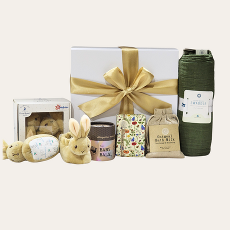 Luxurious Bundle of Joy Baby gift box featuring high-quality essentials for newborns, beautifully presented with a ribbon.