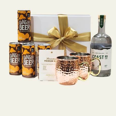 Moscow Mule gift box with premium Coast Vodka, copper mugs, ginger beer, and roasted nut mix, all beautifully presented.